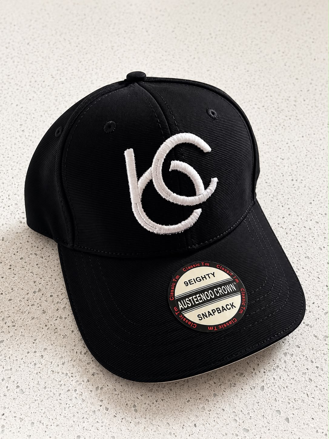 Black face cap.